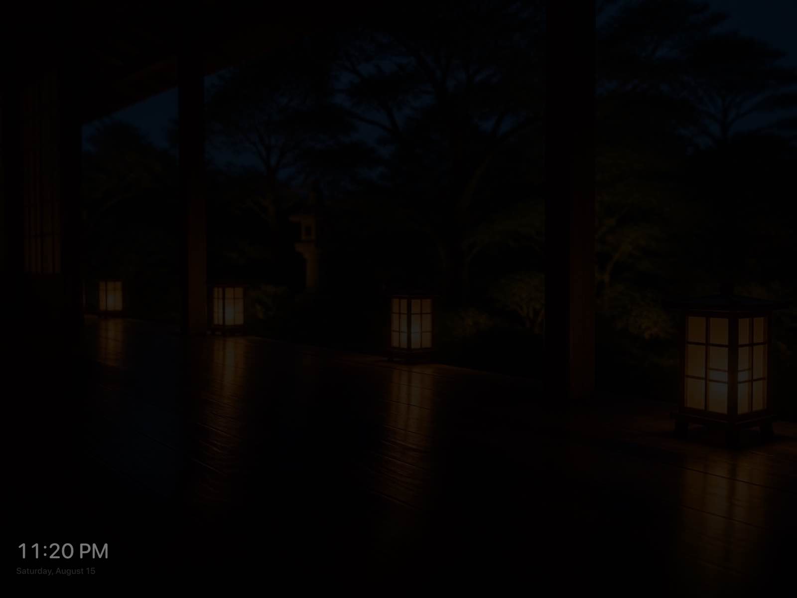 A dimmed night photo of a lantern-lit veranda, with 11:20 PM and the date shown quietly in the lower corner.